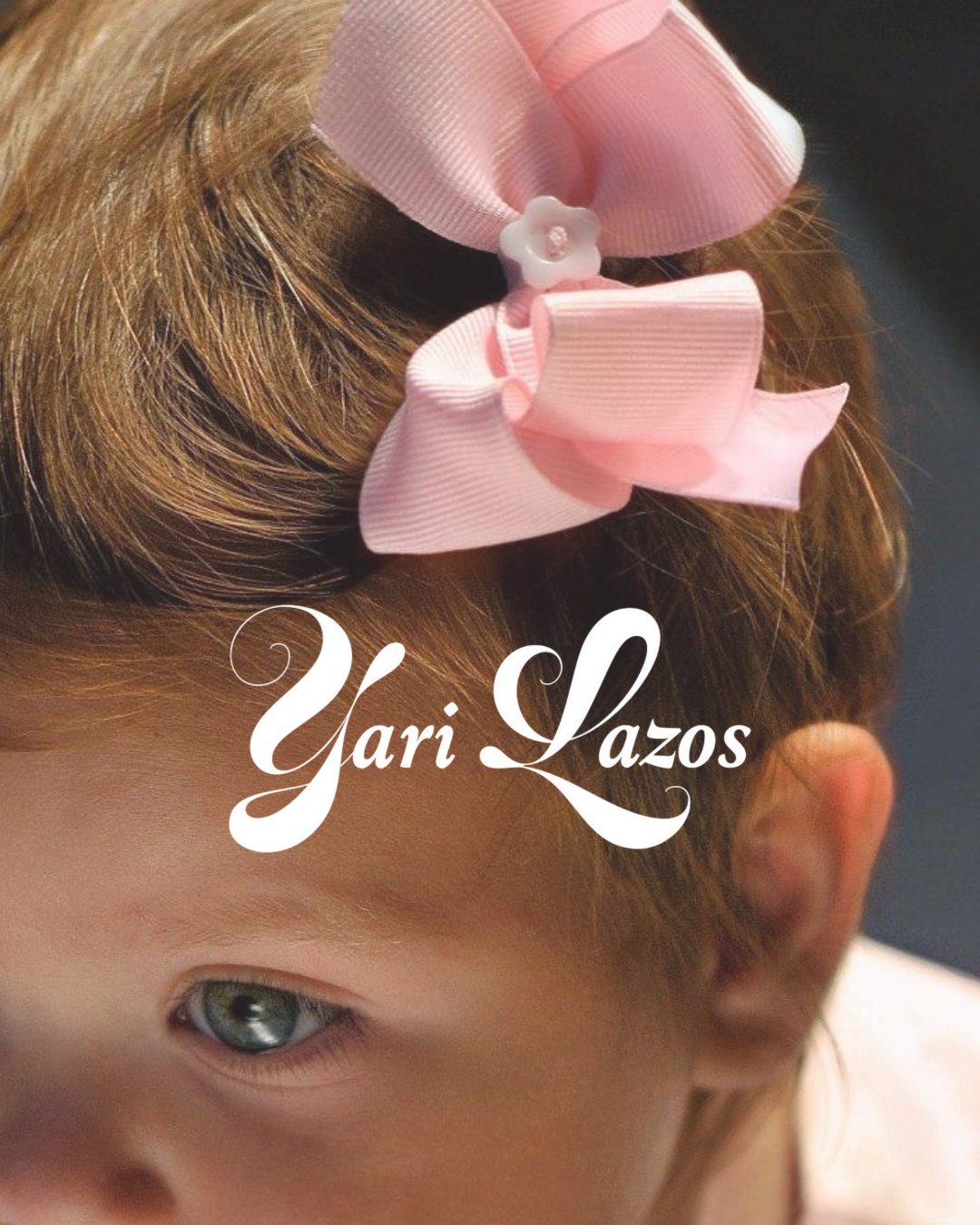 Yari Lazos pink bow being worn, with the original integrated wordmark